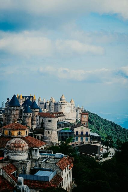 Da Nang: BaNa Hills & Golden Bridge Day Tour With 5 options - French Village at Ba Na Hills: street music, themed buildings, and shows